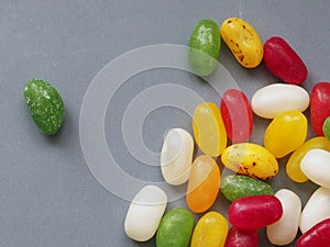 Jellybean sweets on grey background