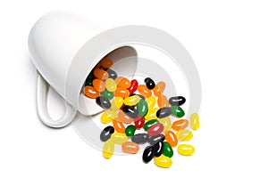 Jellybeans in cup isolated photo