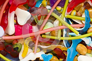 Jellybeans and different colored round candy. Top view. Candy background photo