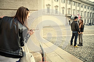 Jelous woman stalking a couple photo