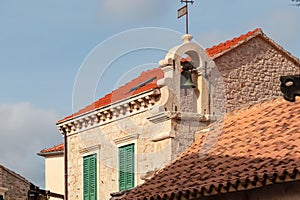 Jelsa - Close up view of ancient building with bell in coastal town Jelsa on Hvar island, Dalmatia, South Croatia, Europe