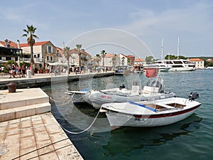 Jelsa, Croatia - July 25, 2021. Old town and promenade full of tourists at the port of the resort on the island of Hvar