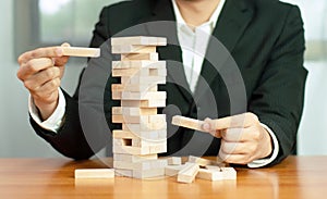 Jenga business game, business fulfillment Building a business base Failed business base Stable and unstable business base. photo