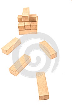 Jenga tower colapsing on a white background