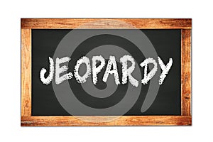 JEOPARDY text written on wooden frame school blackboard photo