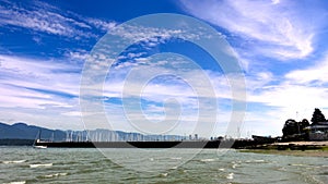 Jericho Beach boats and clouds looking into the city