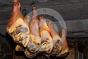 Jerking pork legs on a farm photo