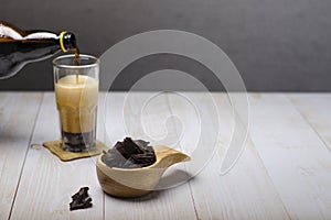 Jerky meat on a wooden background. Dried beef.