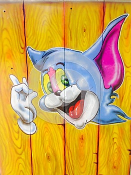 Jerry's portrait (from Tom & Jerry cartoons) on a wooden background