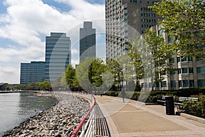 Jersey City New Jersey Riverfront along the Hudson River with Green Trees and Skyscrapers