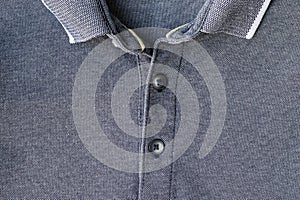 Jersey cotton fabric t-shirt with collar and buttons texture. Gray textile polo background