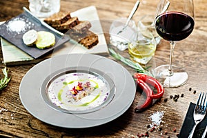 Jerusalem artichoke-almond cream soup with scallop roll. Leek, almond milk, garlic. Delicious healthy Jewish traditional