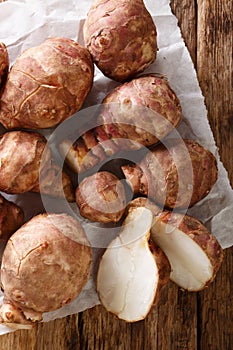 Jerusalem artichoke also called sunroot, sunchoke, earth apple, or topinambour close-up. Vertical top view