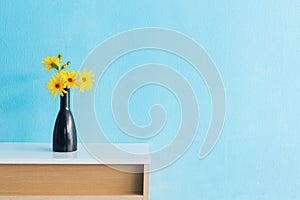 Jerusalem artichoke flower in vase on table interior design