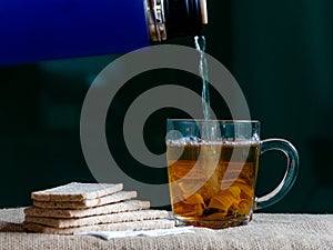 Jerusalem artichoke, herbal tea, dietary product, brewed infusion in a glass mug.