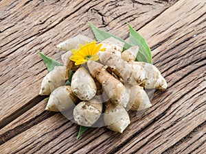 Jerusalem artichoke on wooden table.