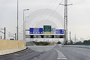 Jerusalem direction sign on Highway 1 in Tel Aviv, Israel Blue road sign for Ben Gurion Airport Exit to the first