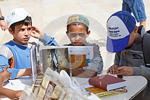 Children writing notes to put in a Wailing Wall in Jerusalem,Israel