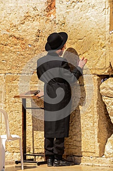 Jerusalem, Israel- July 11, 2014: Orthodox Jewish man praying at Western Wall in Jerusalem, Israel