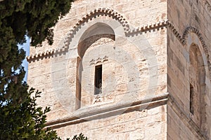 Arabic text carved in stone above the window of a Minaret of the Omar Mosque in the old city of Jerusalem, Israel