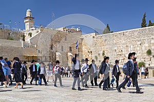 Jewish people praying against the Western Wall in Jerusalem