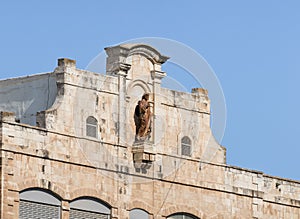 Statue of Jesus Christ on a rooftop of College des Freres near the Jaffa Gate in old city of Jerusalem, Israel