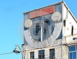 Jerusalem. Synagogue `Clock tower`. Sundial.Oak sprout in pot