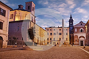 Jesi, Ancona, Marche, Italy: the medieval square Federico II with the obelisk, the cathedral and the ancient buildings photo