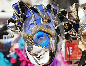 jester mask with rattles for sale in the stall in Venice during the Carnival photo