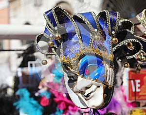 jester mask with rattles for sale in Venetian stall