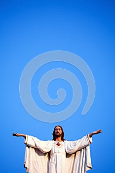 Jesus against blue sky