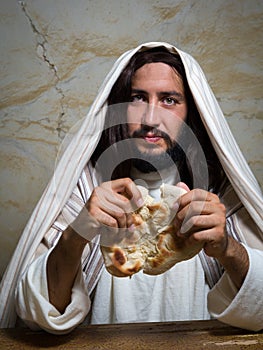 Jesus breaking the bread