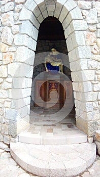 Jesus Christ in the arms of the Mother of God in a small stone shrine on the estate of Nancy and Patrick in Medjugorje.
