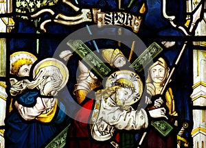 Jesus Christ carrying the cross in stained glass