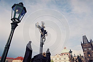 Jesus christ cross on carl bridge in Prauge photo