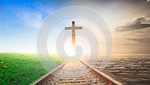 Jesus Christ Cross Concept: Cross on railway sunset background