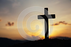 Jesus Christ cross. Easter, resurrection concept. Christian wooden cross on a background with dramatic lighting
