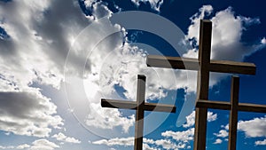 Jesus Christ cross. Easter, resurrection concept. Christian wooden cross on a background with dramatic lighting