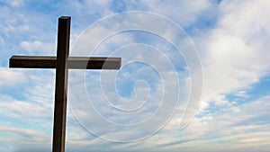 Jesus Christ cross. Easter, resurrection concept. Christian wooden cross on a background with dramatic lighting