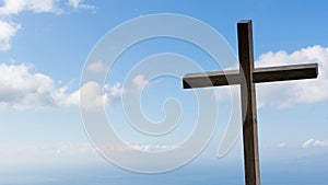 Jesus Christ cross. Easter, resurrection concept. Christian wooden cross on a background with dramatic lighting