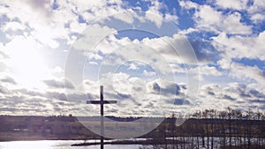 Jesus Christ cross. Easter, resurrection concept. Christian wooden cross on a background with dramatic sky