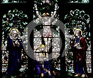 Jesus Christ crucified on the tree of life (stained glass) photo
