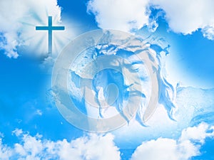 Jesus Christ face and Christian cross in the sky photo