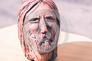 Jesus Christ face clay sculpture