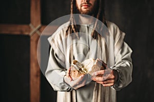 Jesus Christ gives bread to faithful, sacred food