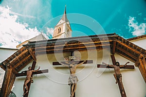 Jesus Christ and martyrs crucifixion on wooden crosses in the Church of St. Leonard.Church of St. Leonard in Lungau