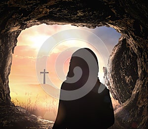 Jesus Christ is risen from tomb with cross photo