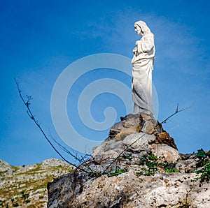 Jesus Christ sculpture on a rock in Mijas.