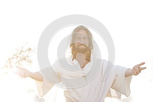 Jesus Christ Smiles From Heaven with Arms outstretched  in Light photo