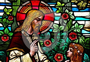 Jesus Christ speaking with a girl, in stained glass